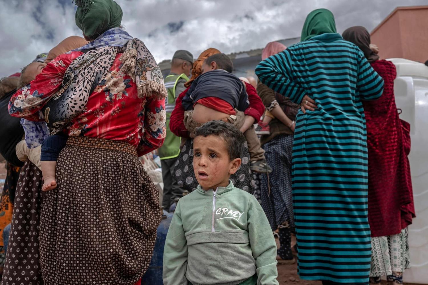 Survivors wait to receive assistance in their village between Marrakesh and Taroudant in the Atlas mountain range on 17 September in the aftermath of a powerful magnitude 6.8 earthquake, Morocco (Bulent Kilic/AFP via Getty Images)